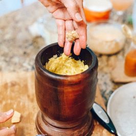 a hand holding a cup