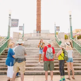 a group of people standing on a beach