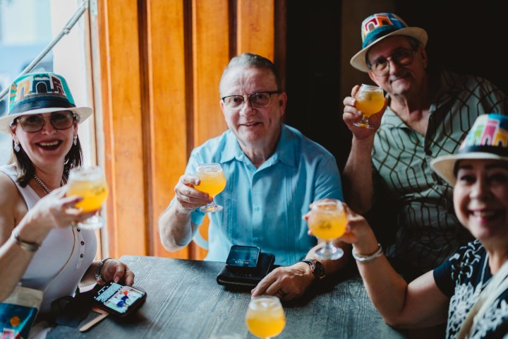 Lawrence Wilkerson et al. sitting at a table eating food